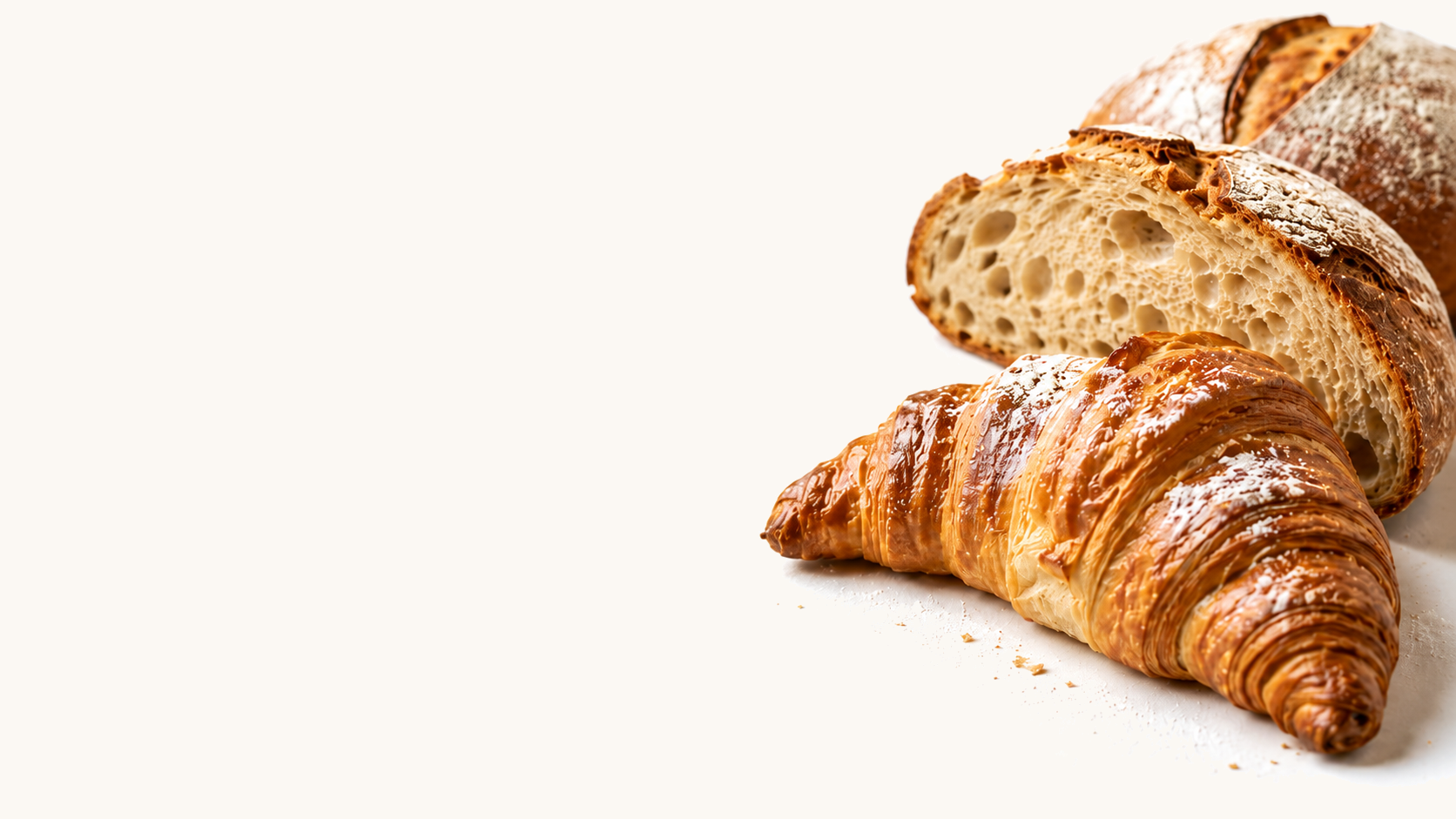 Artisan sourdough loaf and croissant